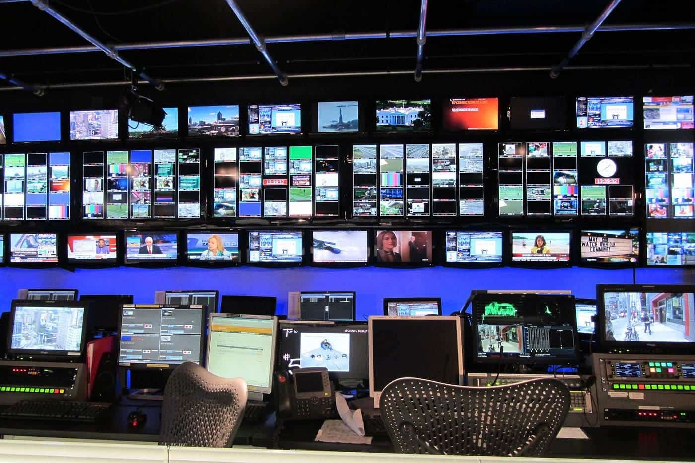 A television control room with banks of monitors and mixing desks