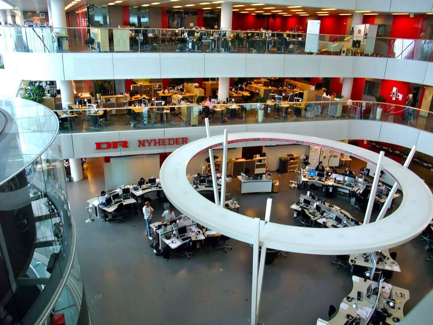 Journalists at work in a broadcaster's newsroom
